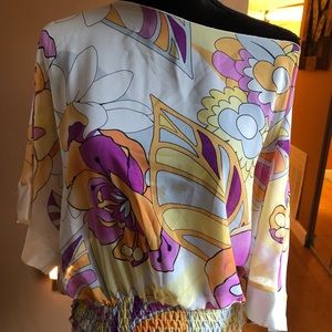 Multi colored off the shoulder shirt.